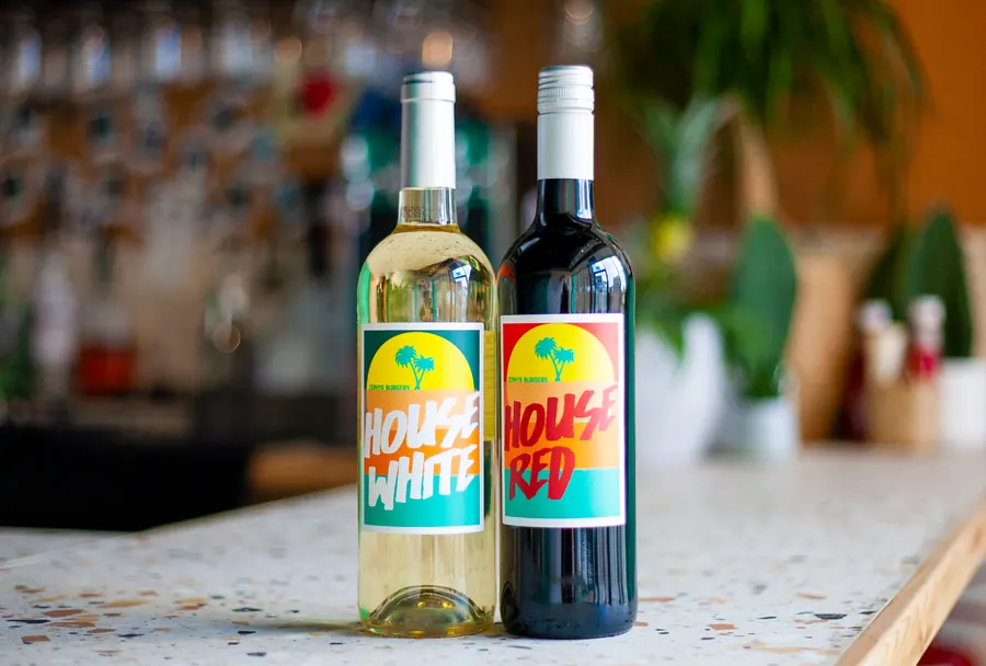 Bottles of Zephyr's own House White and House Red wine