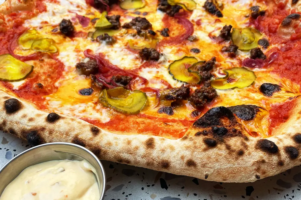 Knead × Zephyr: Cheeseburger Pizza burger special at Zephyr Burgers