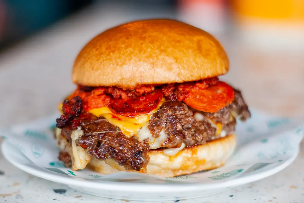 Knead × Zephyr: Pizza Cheeseburger burger special at Zephyr Burgers